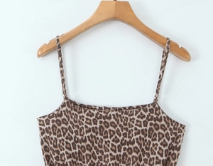 Detail of vintage leopard print camisole with thin straps and smooth fabric texture