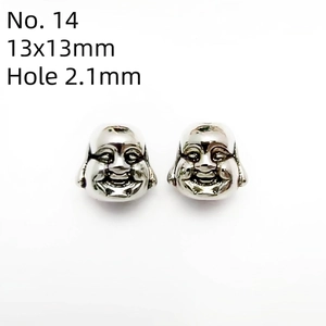 Detailed view of silver Buddha head beads for DIY jewelry with 2.1mm hole size
