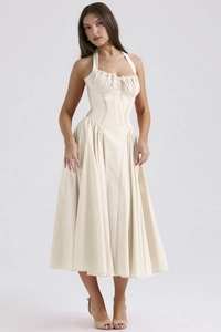 Detail of the halter neckline and corset waist on a floral print beige summer dress