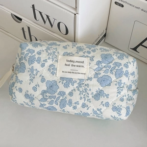 Quilted blue floral cosmetic bag with cotton finish and vintage octagonal shape