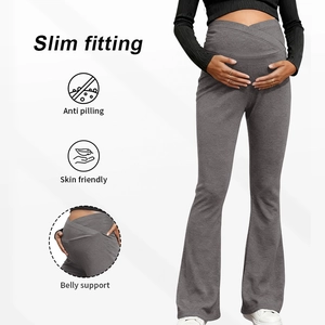 Detail of high waist maternity flare leggings with belly support icons and fabric texture