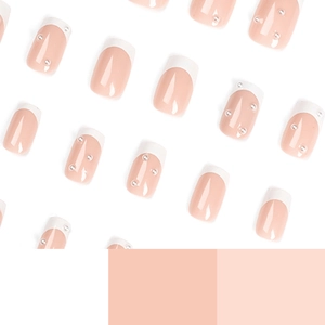 French style press-on nails in nude pink with white tips and elegant pearl accents