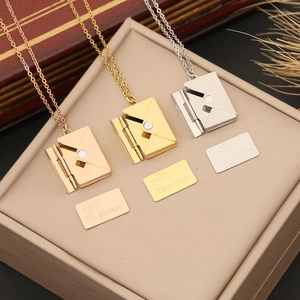 Three-tone stainless steel envelope pendant necklaces with Te quiero heart engraving