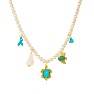 Gold-plated pearl necklace with turquoise turtle, blue fish, and seashell charms on white