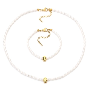 Elegant white rice pearl necklace and bracelet set with golden girl pendant and clasp