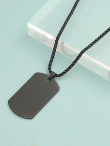 Macro shot of black titanium steel dog tag pendant necklace on marble surface