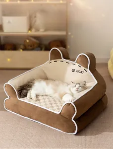 Detail of warm corduroy pet bed with cat ear design and beige checkerboard cushion