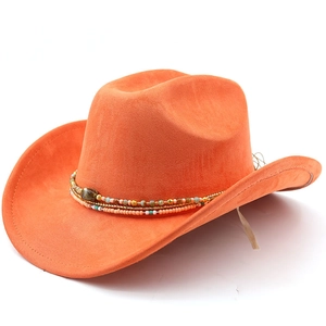 Detail of orange suede cowboy hat featuring bohemian colorful beaded trim and metal accents