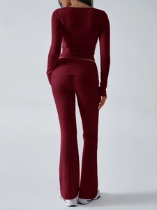 Rear view of burgundy slim fit knitted two-piece set with long sleeves and flared pants