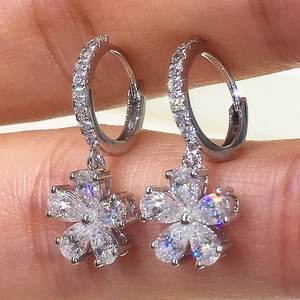 Elegant silver flower hoop earrings with sparkling cubic zirconia floral charms
