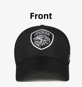 Detailed close-up of a black trucker hat featuring an embroidered lion head shield patch