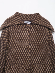 Detail of the large lapel and geometric knit pattern on this vintage autumn cardigan