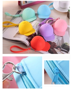 Detail of colorful baseball cap silicone coin purses with zippers and metal keychains