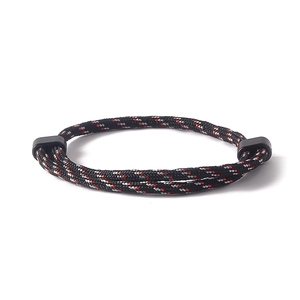Detail of nautical anchor braided rope bracelet with adjustable double black buckles
