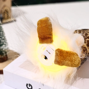 Detail of the LED light switch and soft plush base of the Christmas gnome figurine