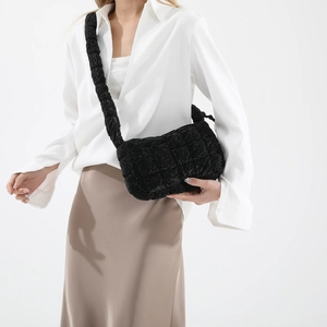 Chic black pleated cloud bag for women with quilted texture and soft shoulder strap