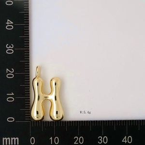 Polished gold H-letter balloon pendant measuring 23mm in height weighing 5.4g