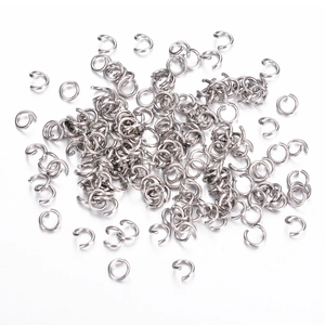 Macro detail of bulk stainless steel open jump rings for DIY jewelry making and linking