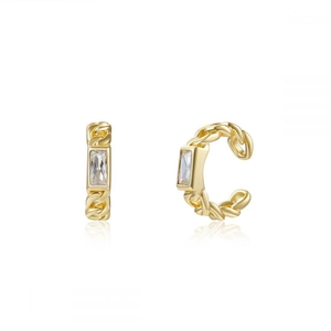Macro view of gold Cuban link ear cuffs with rectangular zircon and smooth reflections