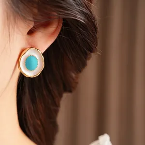Vintage gold oval earrings with blue gemstone and white enamel inlay for women