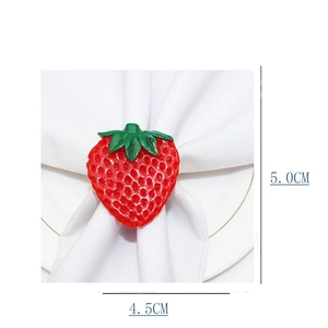 Detailed view of 3D strawberry napkin ring with dimensions 4.5cm by 5.0cm on white cloth