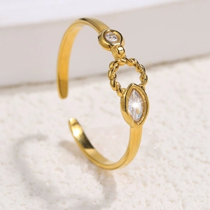 Macro detail of gold adjustable ring with twisted band and clear marquise zircon stone