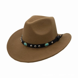 Detail of felt cowboy hat with leather band featuring silver studs and turquoise stones