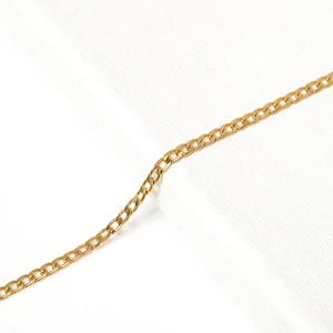 Close-up of golden Cuban link chain links for DIY necklace and bracelet crafting