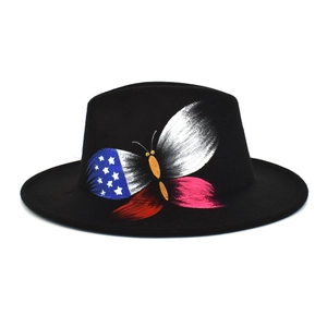Detail view of black wool fedora featuring artistic American flag butterfly print design