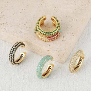U-shaped gold plated ear cuffs with multi-color zircon stones on natural stone