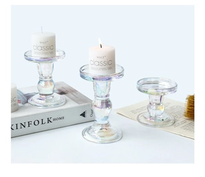 Three-piece set of iridescent glass candle holders in various sizes for home decor