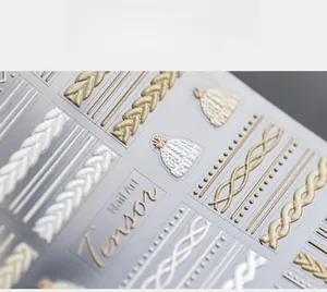 Detailed 5D embossed nail stickers featuring winter sweater textures and knit patterns