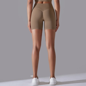 Detail of high-waisted scrunch butt sports shorts with seamless V-shape stitching back