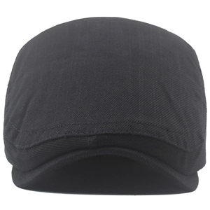 Detail showing black cotton flat cap with twill texture and reinforced double stitching
