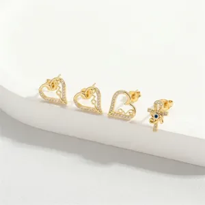 Three pairs of gold heart love stud earrings and blue evil eye set for women