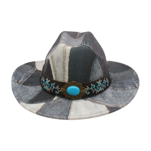 Detail of blue denim western hat with floral embroidery and turquoise gemstone