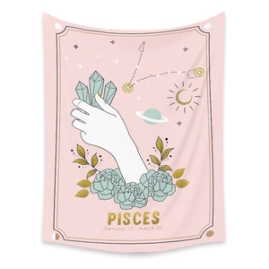 Detail of Pisces zodiac tapestry featuring celestial symbols and floral art on pink background