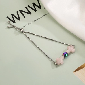 Detail of adjustable silver box chain with pink quartz crosses and iridescent beads