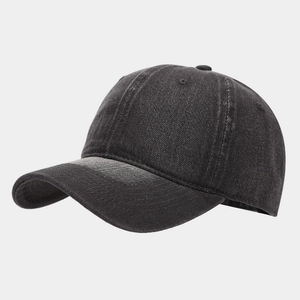 Detail view of washed charcoal denim baseball cap showing fabric texture and seams