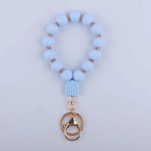 Detail of light blue silicone beaded keychain with rhinestone spacers and gold lobster clasp