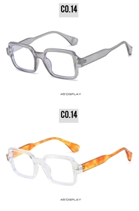 Detail view of square frame sunglasses showing transparent grey and amber tortoiseshell temples