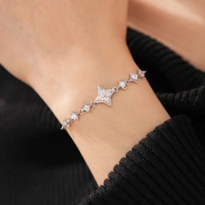 Close-up of star-shaped zircon bracelet on wrist with elegant silver sparkling details