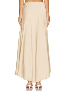 Elegant champagne satin midi skirt showing high-gloss fabric drape and sleek fit