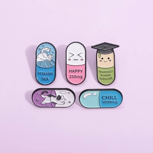 Creative medical enamel pins set featuring colorful capsules with cute patterns and slogans