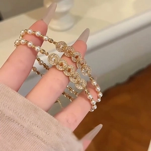 Elegant gold double-layer bracelet with pearls and zircon coin charm for women