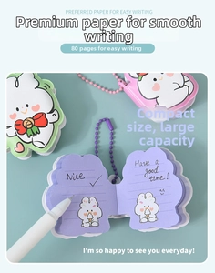 Detail view of mini rabbit notebook with 80 pages of colorful lined paper and bead chain