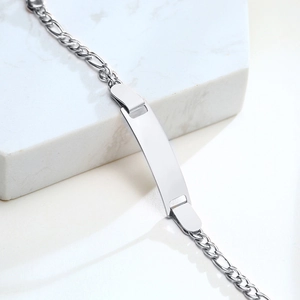 Detail of adjustable stainless steel Figaro ID bracelet for children with blank curved plate