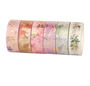 Detail of 6 rolls decorative washi tape set featuring gold foil accents and floral patterns
