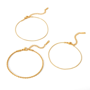 Three-piece gold titanium steel bracelet set with snake, twisted, and beaded chain designs
