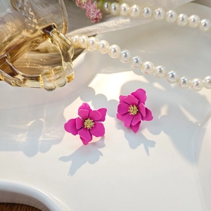 Macro detail of layered 3D rose petals with golden stamens and a matte pink finish